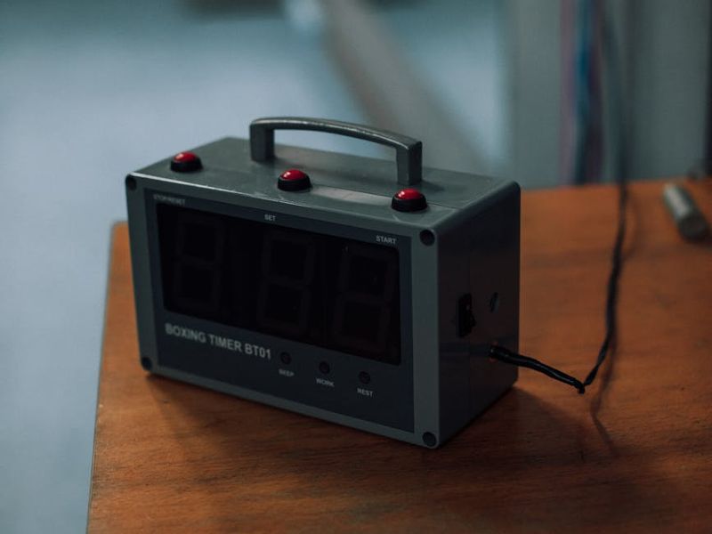 Close up of sports timer and sweat on floor